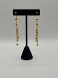 Golden Triple Cascade Ball Earrings
Trinity Ball Chain Drop Earrings
