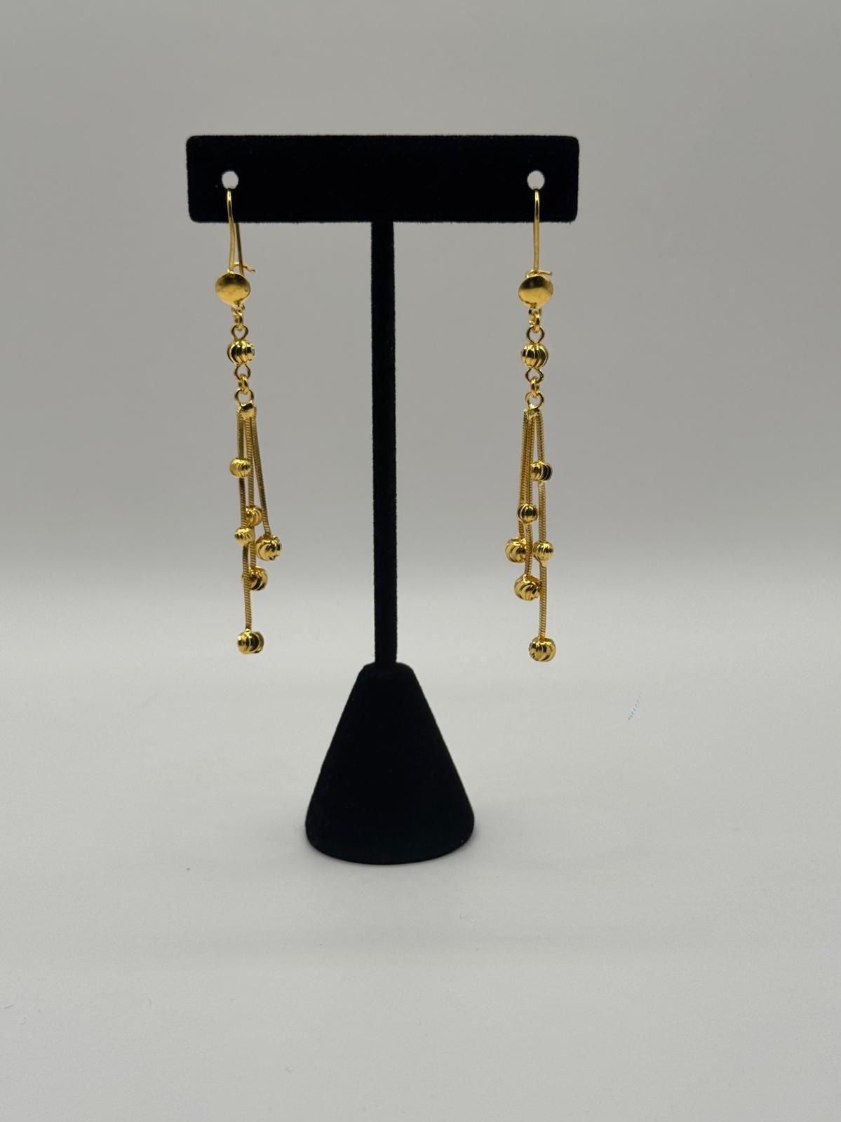 Golden Triple Cascade Ball Earrings
Trinity Ball Chain Drop Earrings