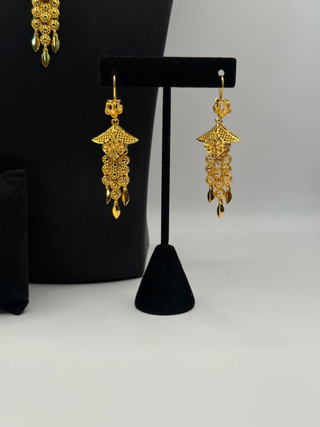 Intricate filigree and floral-inspired detailing