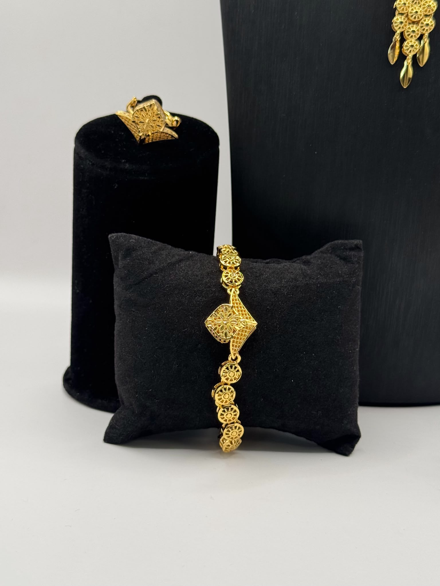 Intricate filigree and floral-inspired detailing
