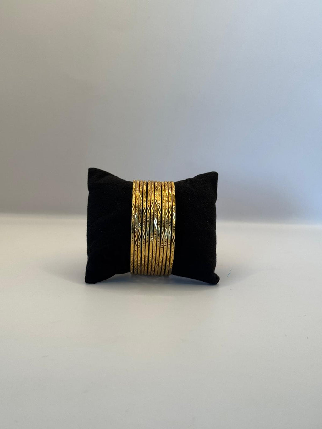 Golden Elegance – 12-Piece Textured Bangle Set