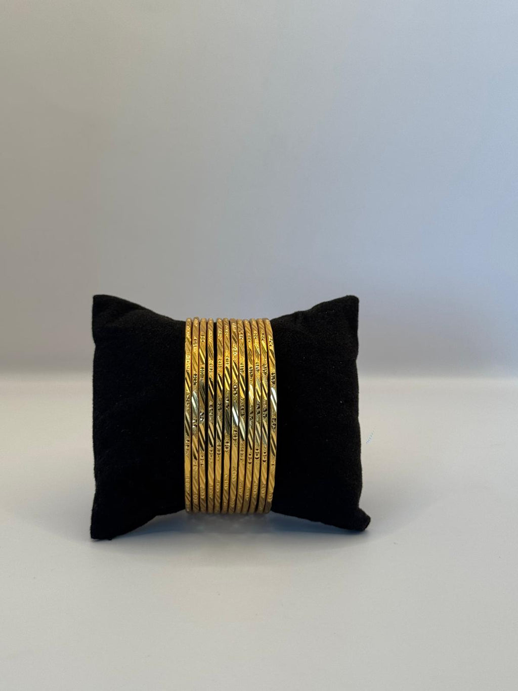 Golden Elegance – 12-Piece Textured Bangle Set